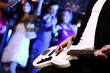Young guitar player performing in night club