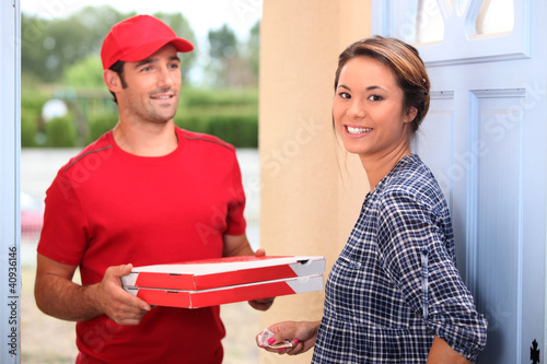 Photo: young man delivering pizza young man delivering pizza