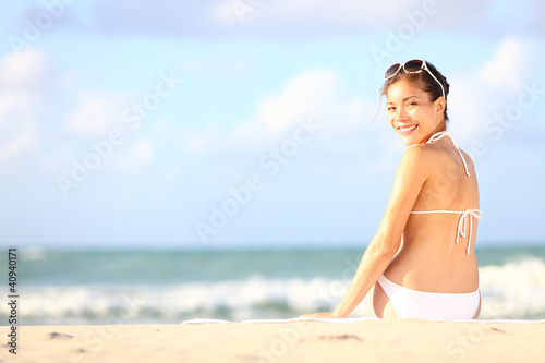 Photo: Vacation woman sitting on beach Vacation woman sitting on beach