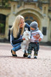 Young woman showing a fancy rabbit to her son