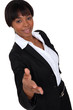 Businesswoman holding her hand out for a handshake
