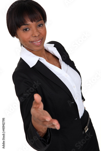 Photo: Businesswoman holding her hand out for a handshake Businesswoman holding her hand out for a handshake
