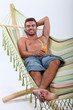 man lying in a hammock man lying in a hammock