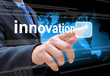 businessman hand pushing innovation button