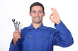 Mechanic making OK gesture