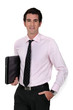 Businessman carrying laptop underarm
