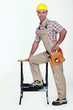Carpenter stood by work-bench Carpenter stood by work-bench
