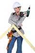 Woman with a drill and a frame Woman with a drill and a frame