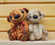 Teddy bears against a wooden wall