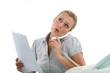 Woman on the phone next to a fax machine