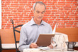 Man looking at a menu in a restaurant
