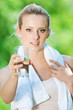 Woman drinking water after exercise Woman drinking water after exercise