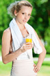 Woman drinking juice after exercise Woman drinking juice after exercise