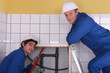 portrait of two plumbers