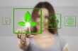Young woman pressing  recycle icons over white background