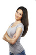 attractive young woman standing with her hand folded isolated