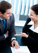 Businesspeople with documents at office