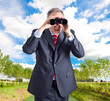Businessman using binoculars