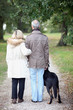 Senior people having a walk with dog