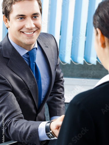 Photo: Businesspeople or businessman and client Businesspeople or businessman and client