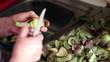 Hands scrubbing  artichoke