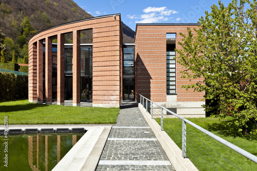 Photo: modern bricks house, surrounded by nature modern bricks house, surrounded by nature