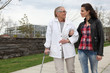 Photo: Woman strolling with an elderly lady Woman strolling with an elderly lady