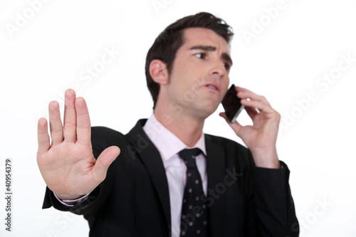 Photo: businessman receiving important call businessman receiving important call