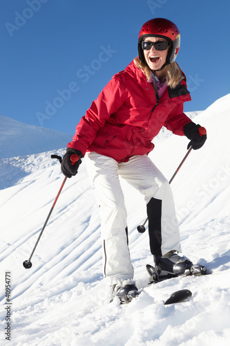 Photo: Woman On Ski Holiday In Mountains Woman On Ski Holiday In Mountains