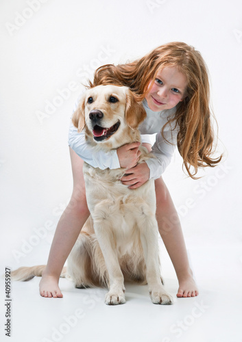 Photo: Little girl and dog Little girl and dog