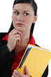 Secretary holding a binder