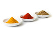Colorful spices in white pods isolated on white