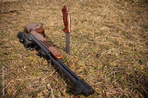 Photo: Rifle and knife on a grass Rifle and knife on a grass