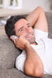 Closeup of a man talking on the telephone at home