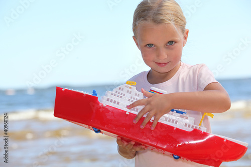 Photo: Girl playing with boat Girl playing with boat