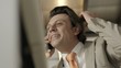 Business man in office talking on telephone and working