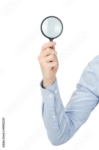 Foto: hand holding magnifying glass hand holding magnifying glass