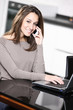young woman working on her laptop