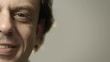 Close-up portrait of happy caucasian adult man smiling at camera