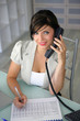 Attractive secretary sitting at a desk