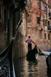 Gondolier on grand canal, Venice, Italy