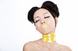 Young asian female with creative yellowl makeup Young asian female with creative yellowl makeup