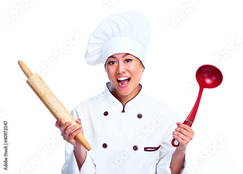 Foto: Young chinese chef woman. Young chinese chef woman.