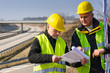 Geodesist read plans on construction site