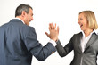Young business colleagues giving each other a high five isolated