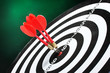 dart board with darts on green background