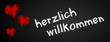 Tafel herzlich willkommen mit Herzen