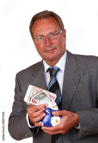 Foto: Mann mit Geld und Sparschwein Mann mit Geld und Sparschwein
