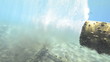 Outlet pipe discharging some form of waste into the ocean.