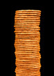 Foto: The high pile of crackers isolated on a black background The high pile of crackers isolated on a black background